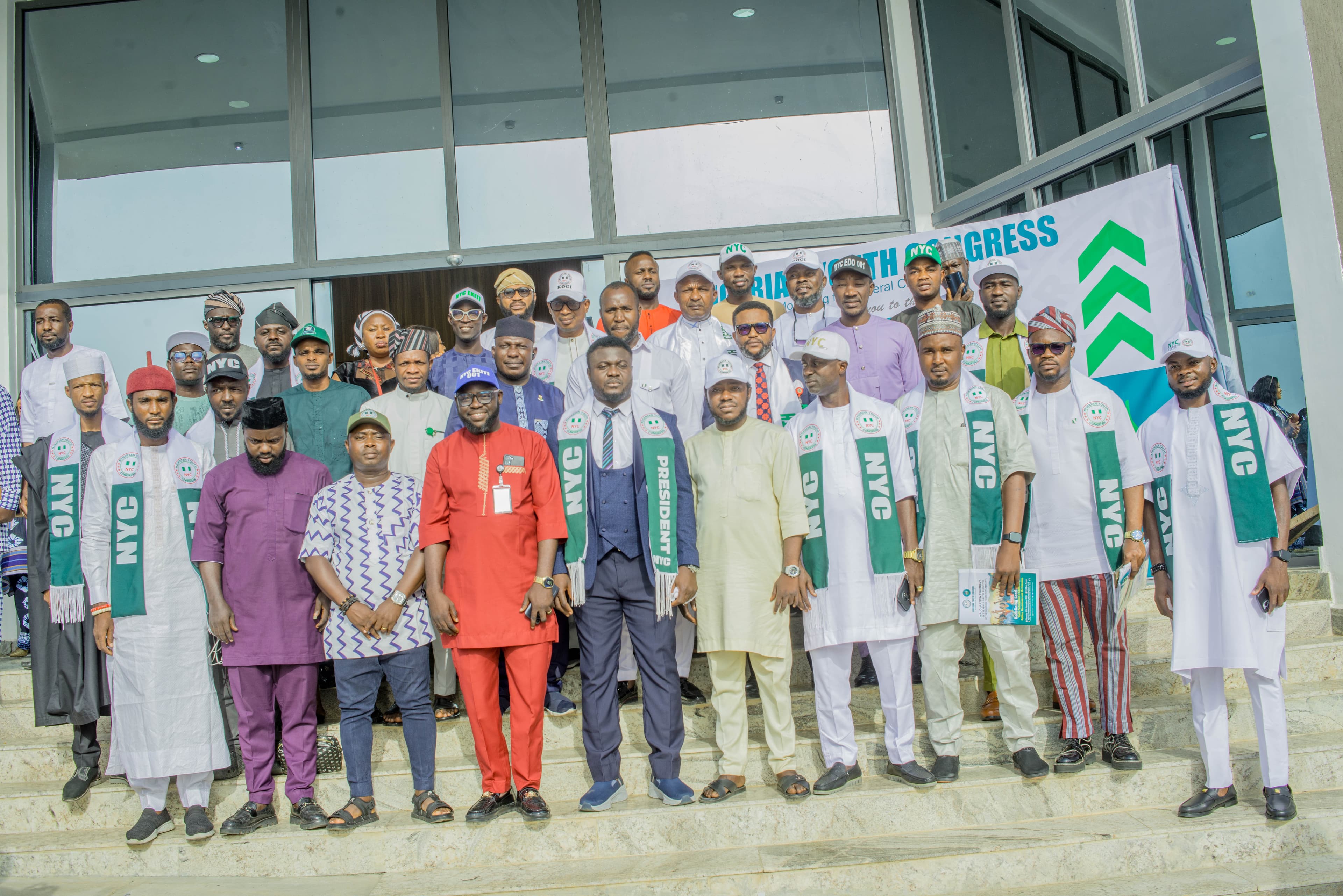 Members of the Nigerian Youth Congress gathered on the steps of a building